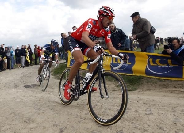 Fabian Cancellara (Saxo Bank) leads Bjorn Leukemans (Vacansoleil) through a cobbled corner at Paris-Roubaix