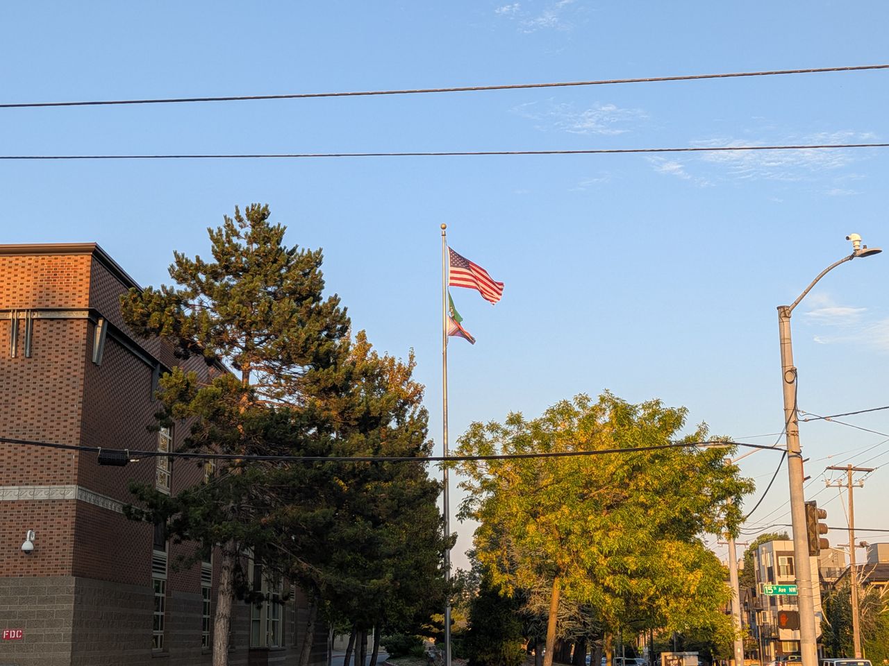 A flagpole next to a building