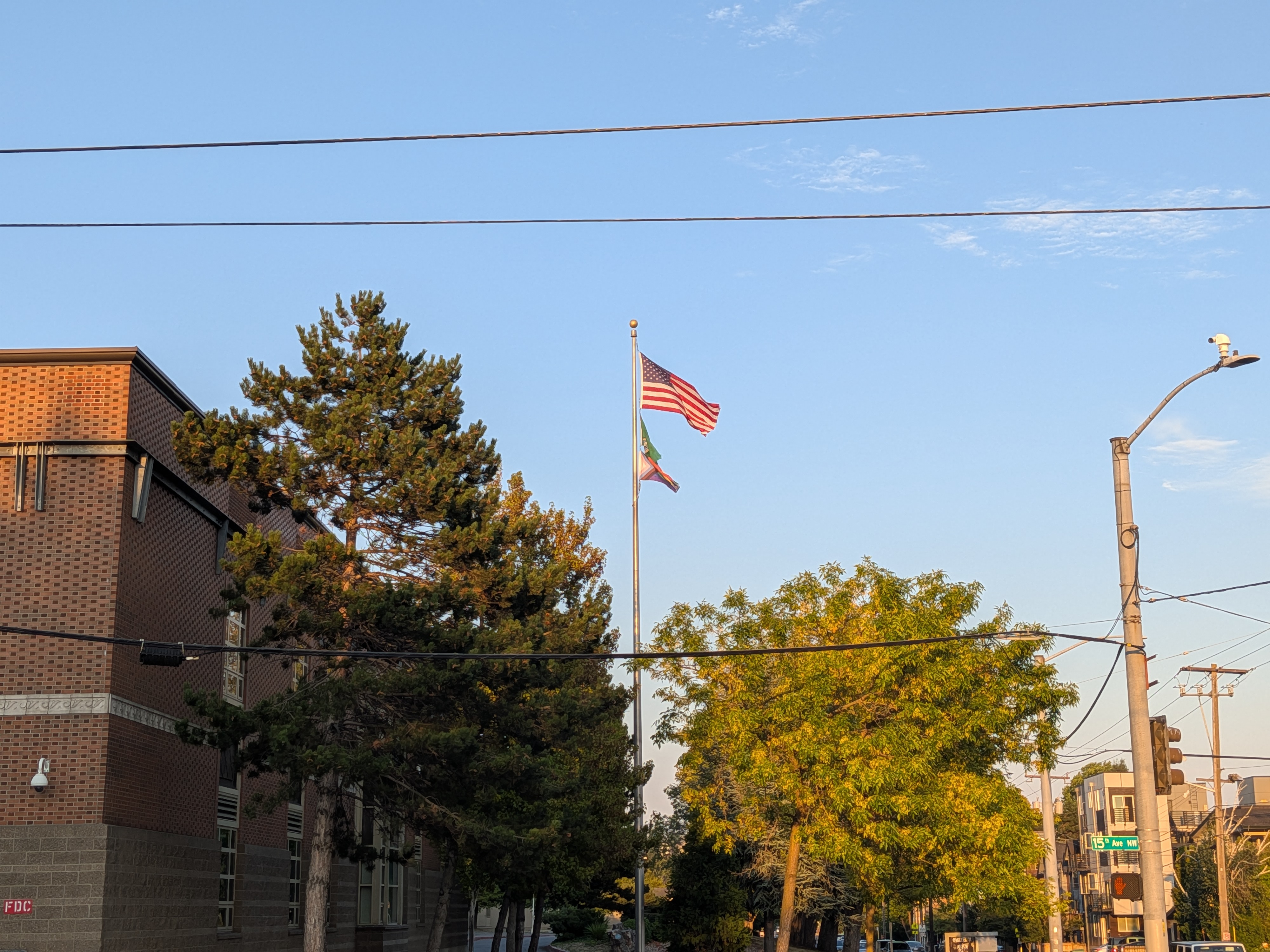 A flagpole next to a building