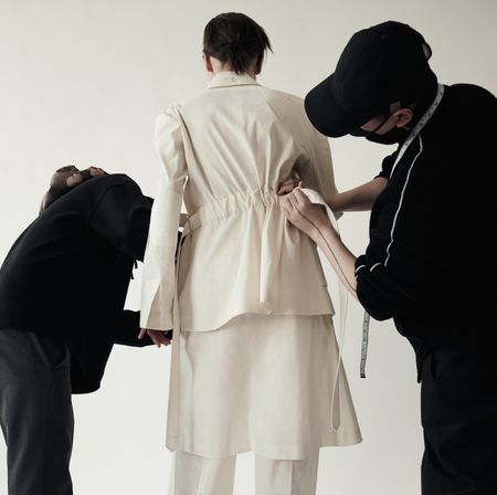 An image of Peter Do working on a garment for BR x Peter Do