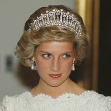 Princess Diana wears a white lace bateau neck dress with the Spencer Tiara