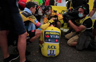 Team Jumbo-Visma rider Slovenias Primoz Roglic wearing the overall leaders yellow jersey down rests after crossing the finish line at the end of the 20th stage of the 107th edition of the Tour de France cycling race a time trial of 36 km between Lure and La Planche des Belles Filles on September 19 2020 Photo by Christophe Petit Tesson various sources AFP Photo by CHRISTOPHE PETIT TESSONAFP via Getty Images