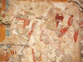 Here, a painting on a tomb wall showing Khonsu and his wife worshipping the gods Osiris and Isis.