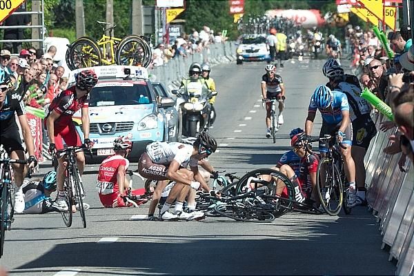Riders pick themselves off the tarmac after crashing 100m from the finish line.