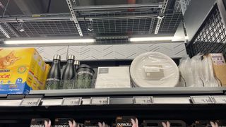 Morrisons products next to Amazon Fresh branded items on a shelf