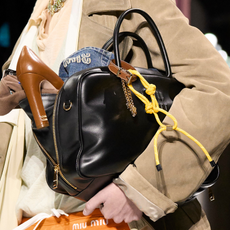 Miu Miu model wearing paracord trend bag charm. 