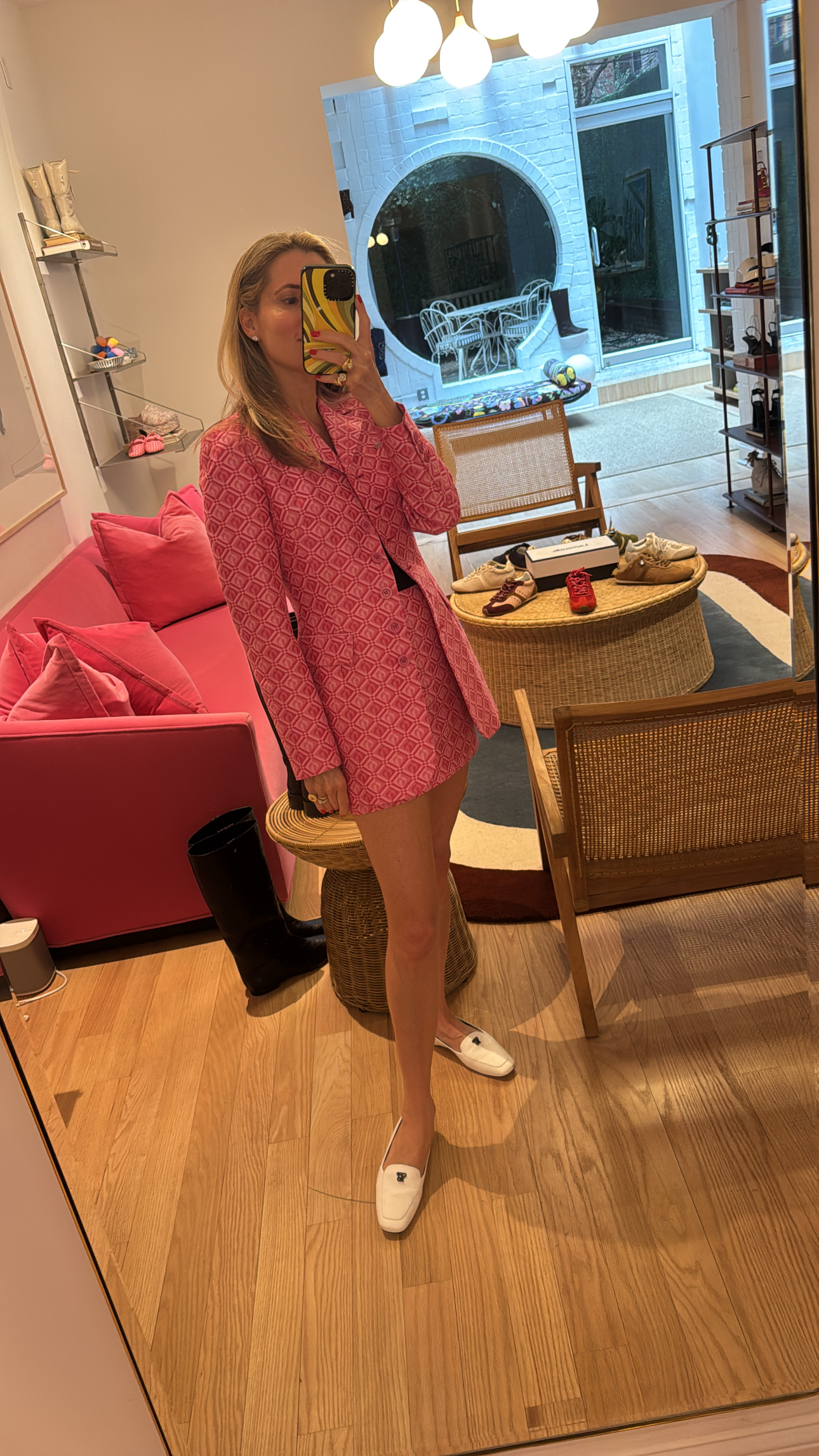 Marina Larroudé wearing a pink suit set and white shoes