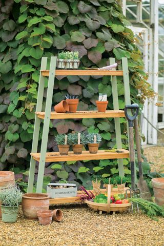 tiered garden storage unit used to store and display plants