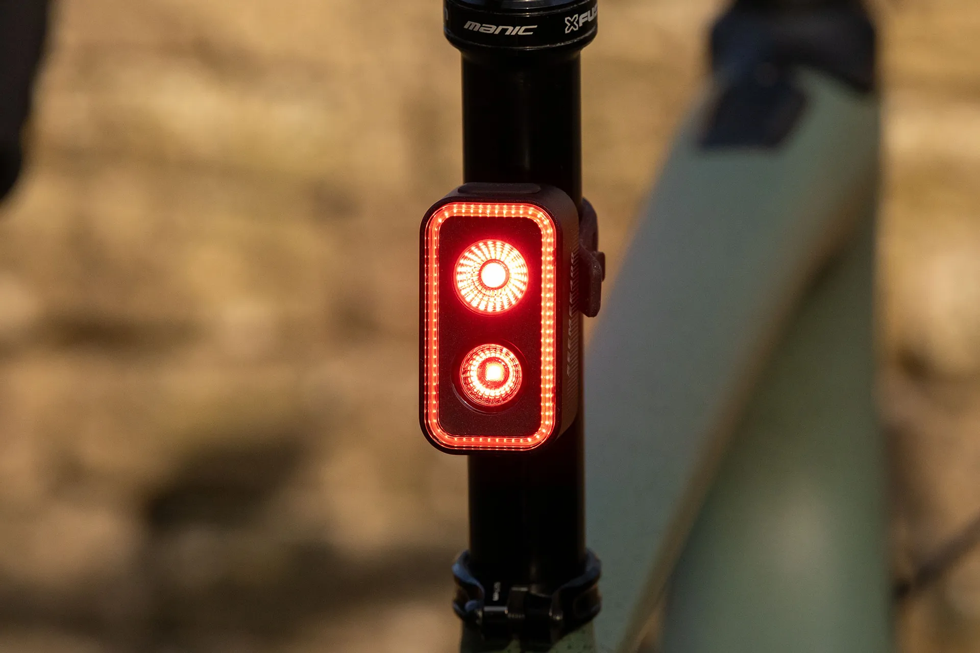 The Magishine Seemee 400 smart rear bike light, with its vertically stacked LEDs and rectangular outer strip, is mounted to the seatpost of a Specialized Turbo Creo