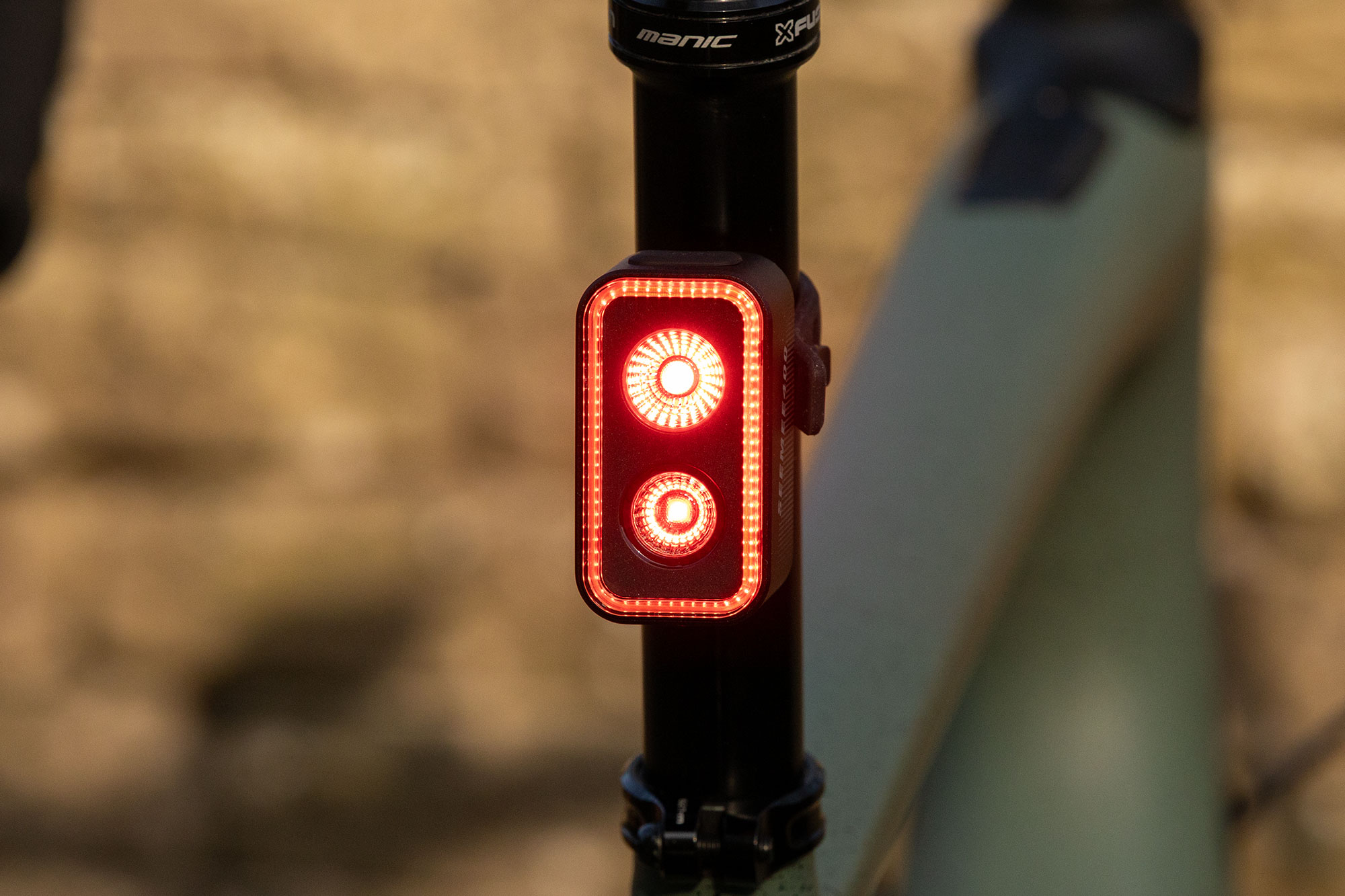 The Magishine Seemee 400 smart rear bike light, with its vertically stacked LEDs and rectangular outer strip, is mounted to the seatpost of a Specialized Turbo Creo