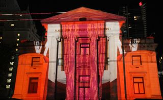 an art projection projection by Renée Van Halm on the exterior of a building