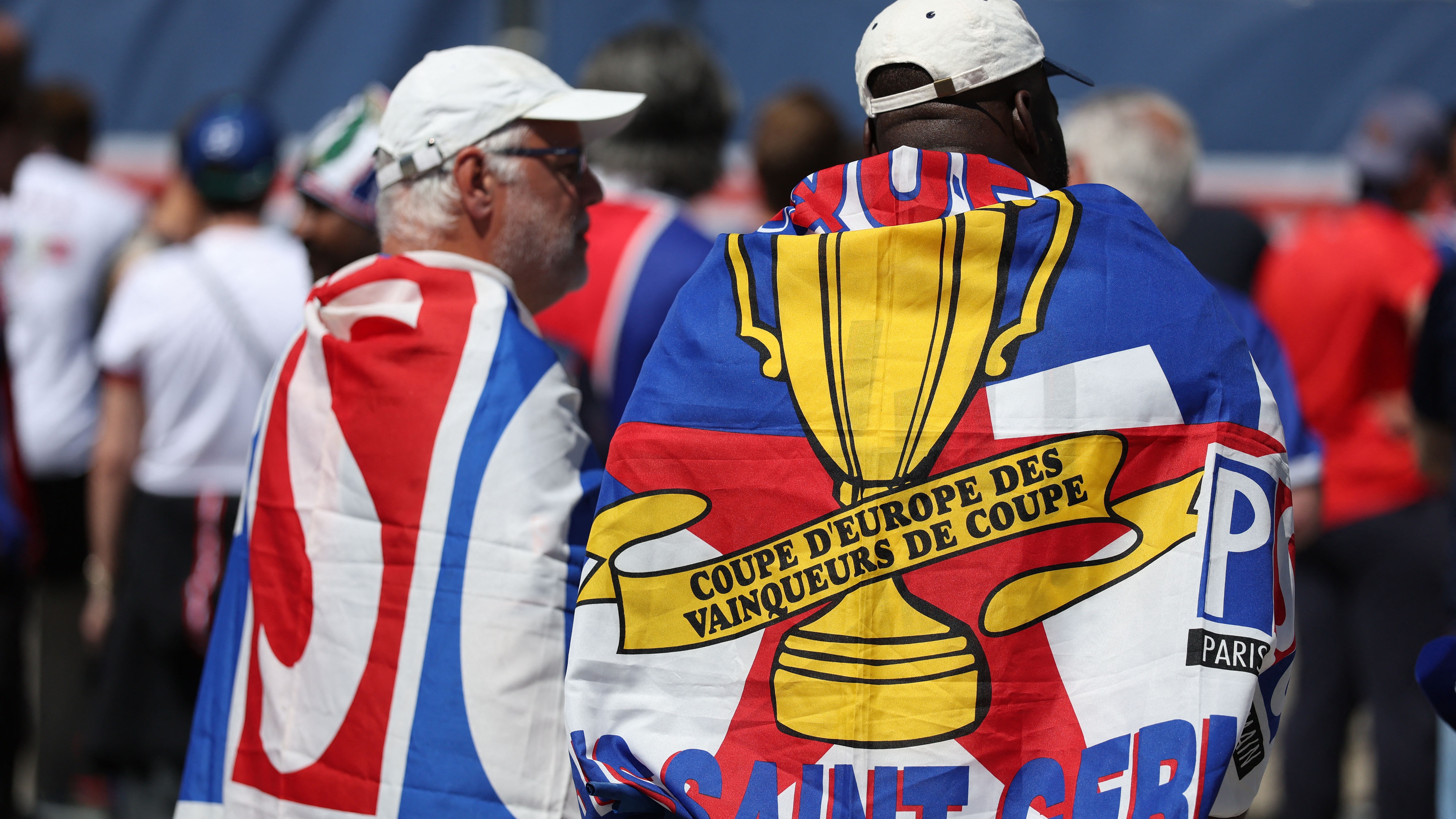 Fans of Paris Saint-Germain cheer in the streets of Munich, southern Germany, prior to the UEFA Champions League final football match between Inter Milan and Paris Saint-Germain (PSG) in on May 31, 2025. 