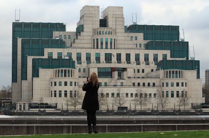 British officials say they've had to pull MI6 and other covert agents after Russia and China cracked Edward Snowden's files