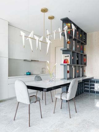 White kitchen with narrow built in dining table