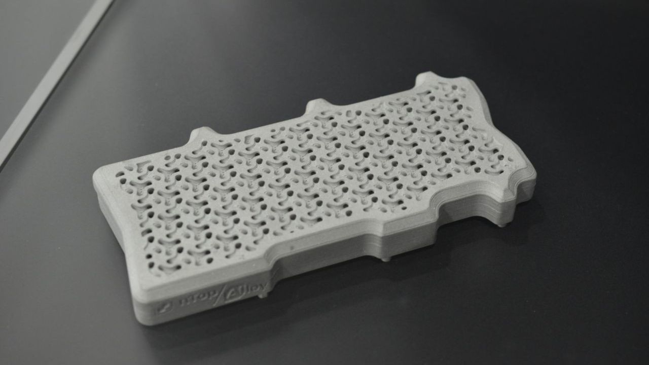 A photo of a custom cold plate for an Nvidia H100, designed and manufactured by Alloy Enterprises, after modelling the optimal fluid flow by nTop