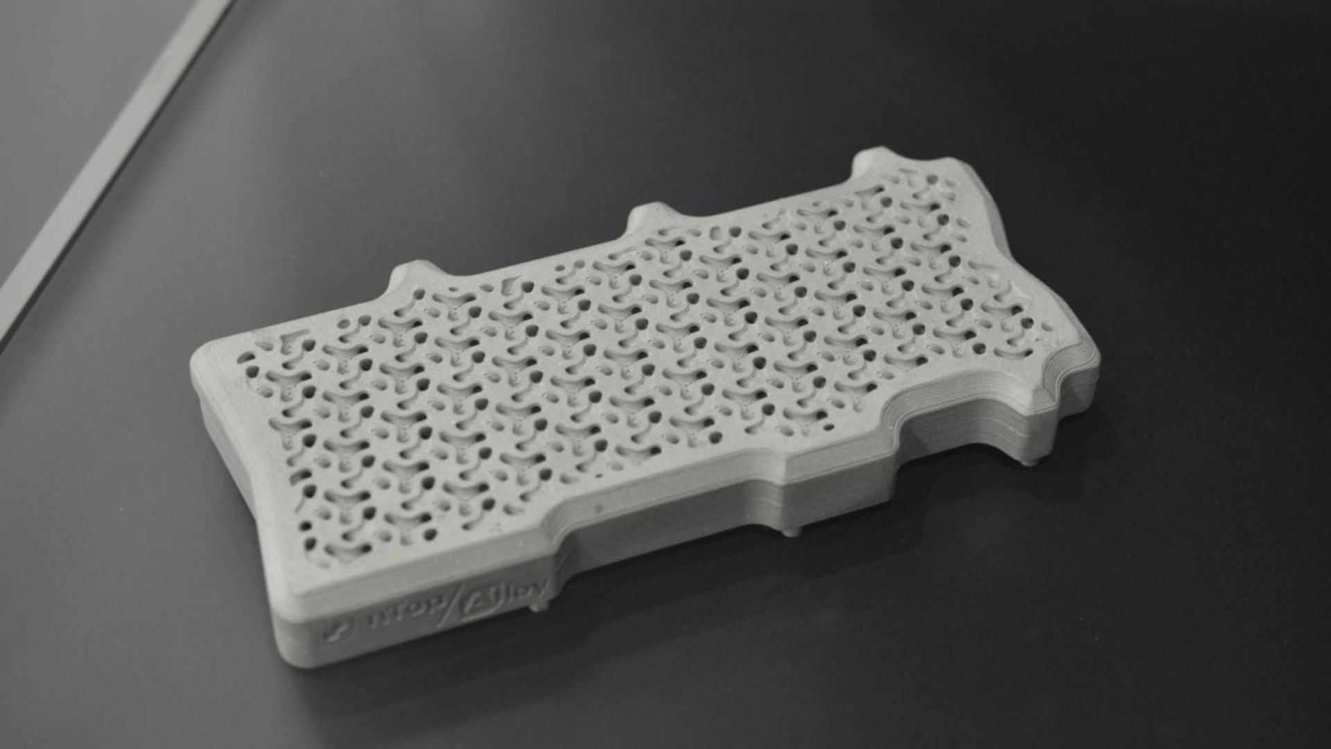 A photo of a custom cold plate for an Nvidia H100, designed and manufactured by Alloy Enterprises, after modelling the optimal fluid flow by nTop