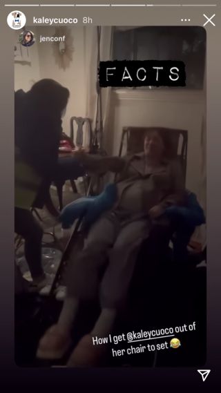 Kaley Cuoto getting out of a chair while pregnant