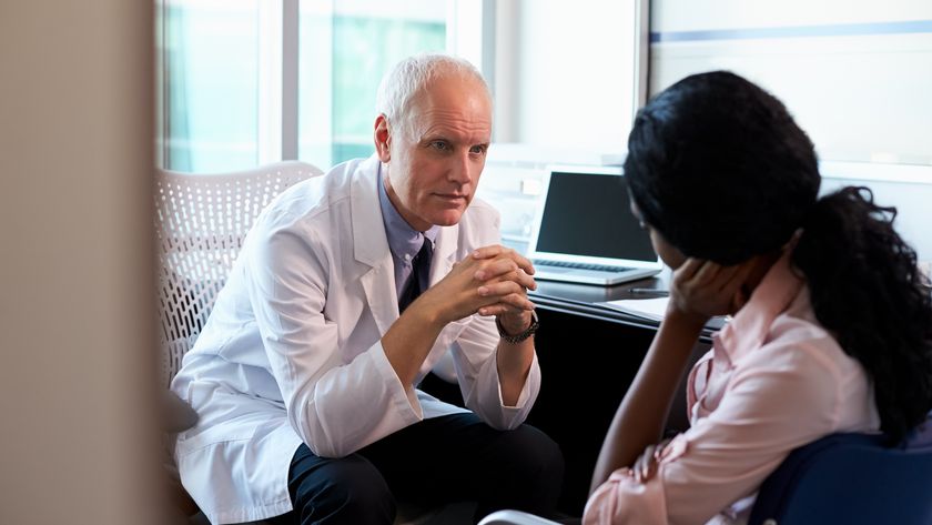 a doctor talks to a patient