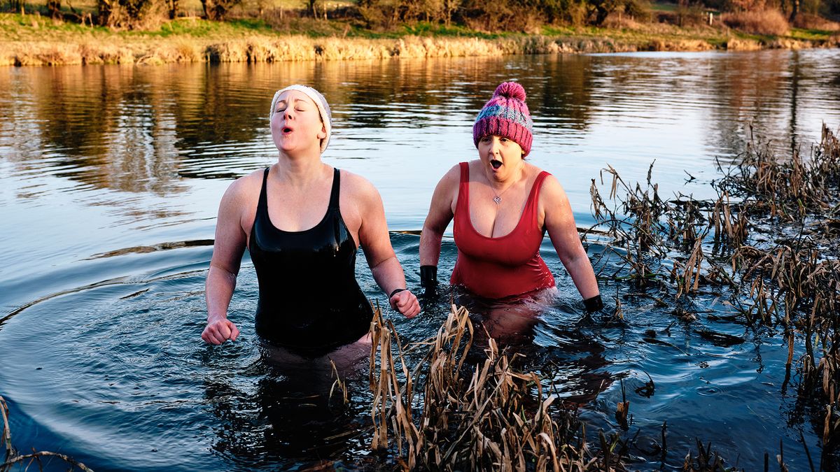 Women wild swimming in cold water