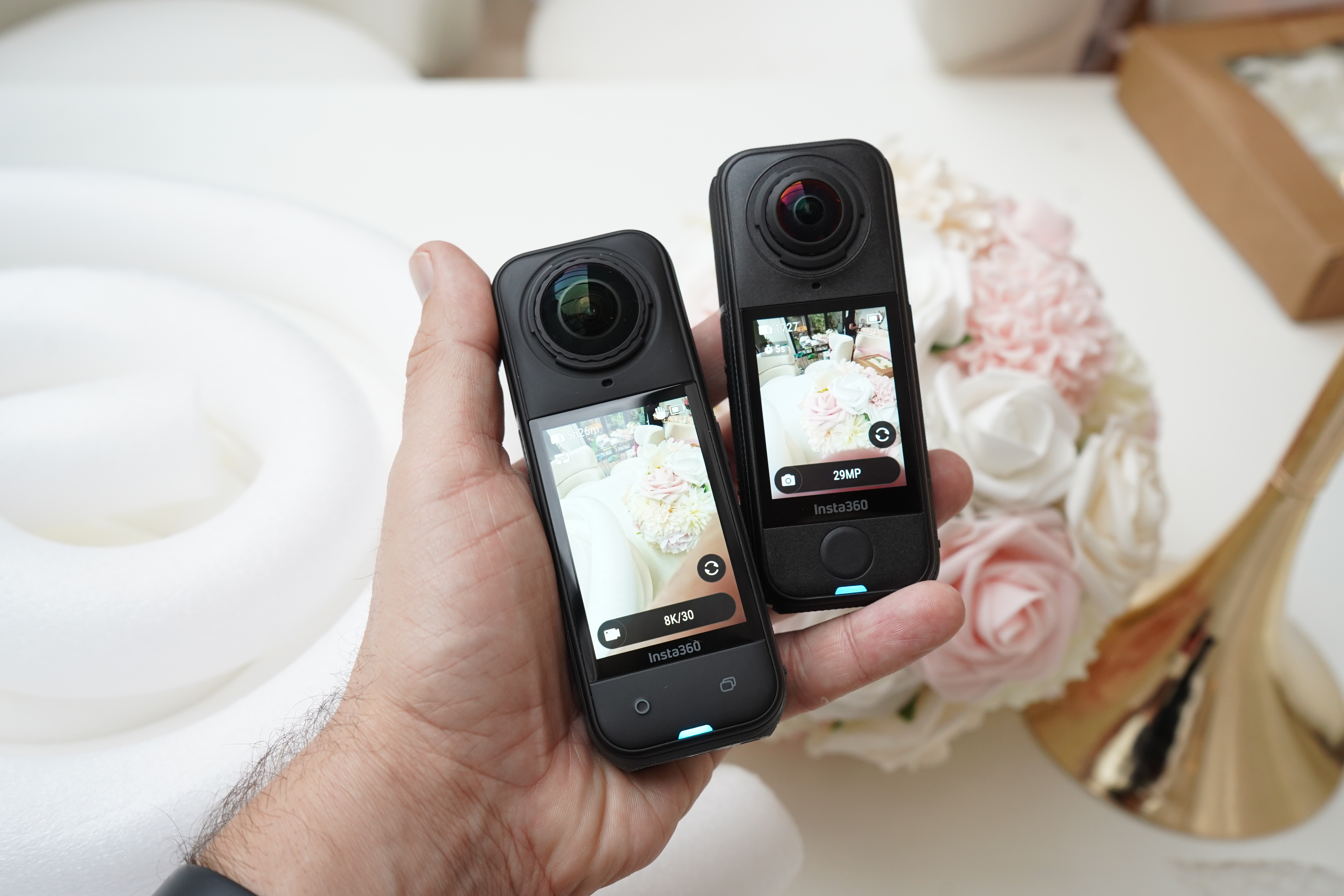 Insta360 X5 and Insta360 X4 Air in the same hand