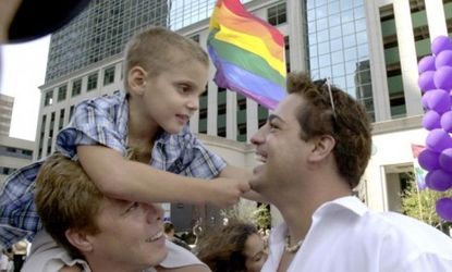 A boy and his father at a gay pride parade in 2001: A new study that attempts to make a case against gay adoption is drawing criticism for its problematic methodology.
