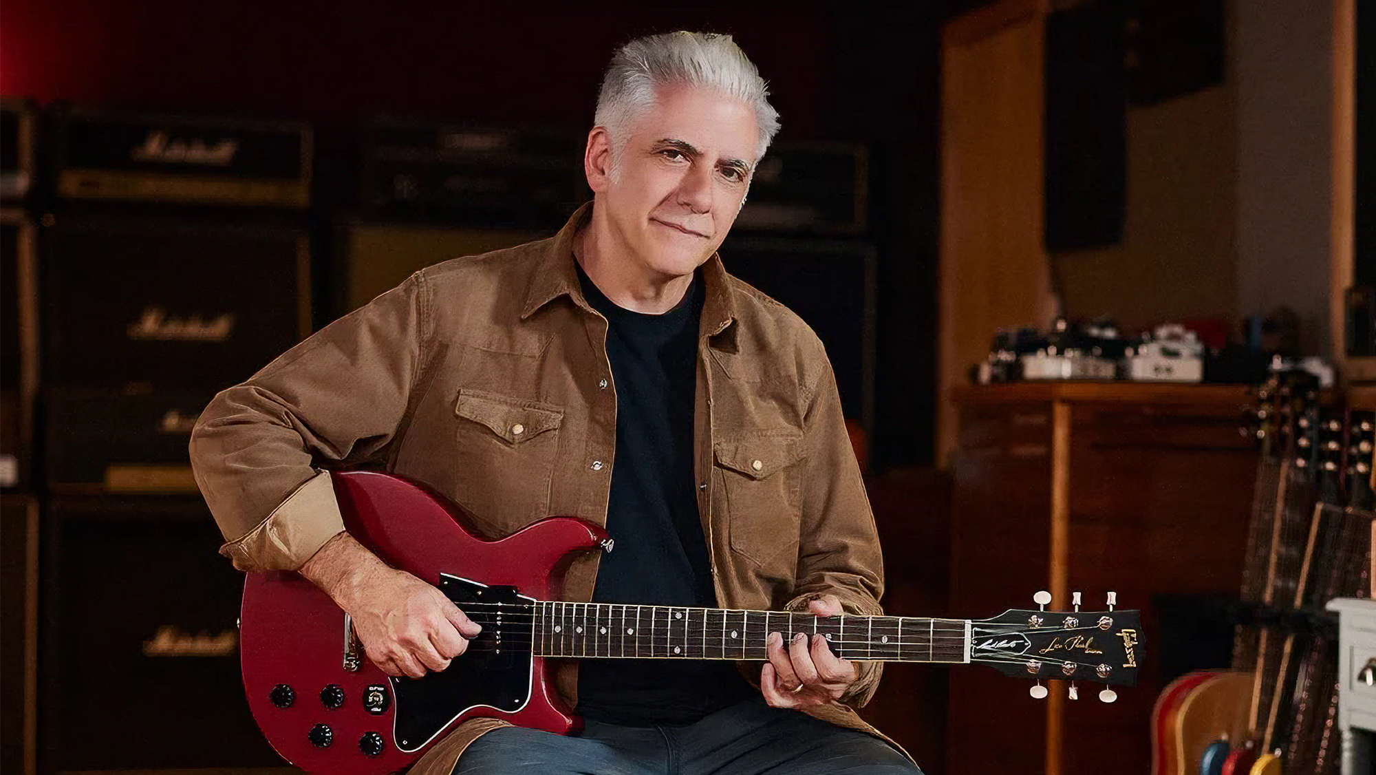 Rick Beato poses in his studio