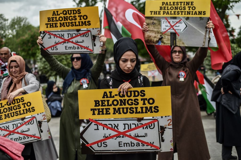 Women protestors hold placards reading 'Al Quds belongs to muslims' on May 11, 2018 in Istanbul, during a demonstration against US President Donald Trumps controversial decision to recognise