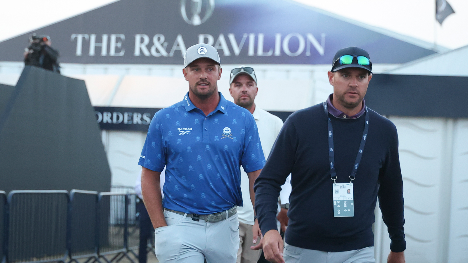 Bryson DeChambeau walks out the booth