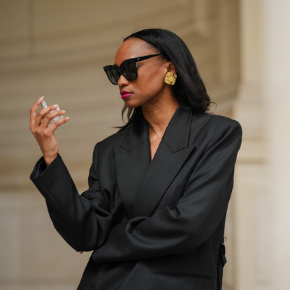 Woman spraying perfume 