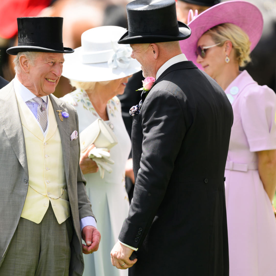 King Charles laughing and talking to Zara Tindall and Mike Tindall at Royal Ascot