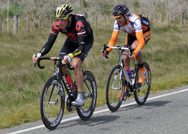 Hayden Roulston of Caulder Stewart leads the race with Jack Bauer of Share the Road on his wheel