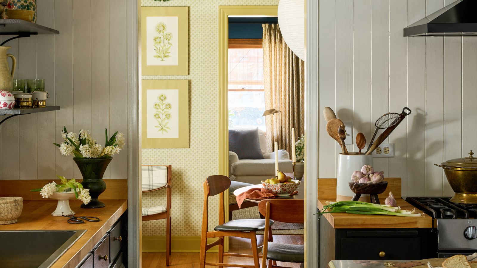 rustic kitchen with doorway leading into pale yellow dining room