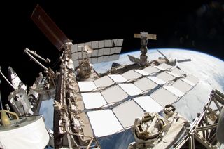This stunning photo taken by Endeavour shuttle astronaut Greg Chamitoff shows four different spaceships linked together in orbit. At the far left is Endeavour, while Russia's Soyuz capsule