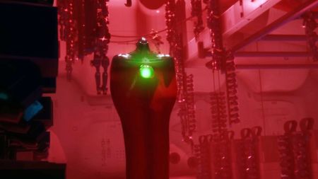 Marathon: The Compiler boss inside a small room bathed in a red glow.