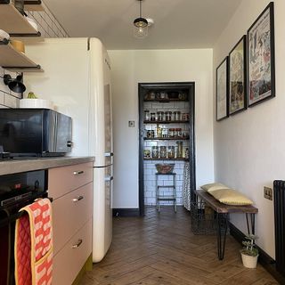 kitchen with white walls radiator and refrigerator