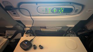 Bowers & Wilkins Pi8 plugged into an in-flight entertainment system