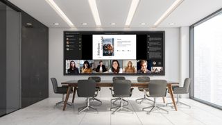 A conference room with a massive new Avocor display showing videoconferencing participants as well as documents.