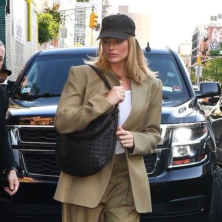 Margot Robbie wearing a tan suit