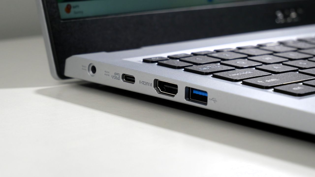 Acer Aspire 3 15 open on a white desk, highlighting the ports on the left.
