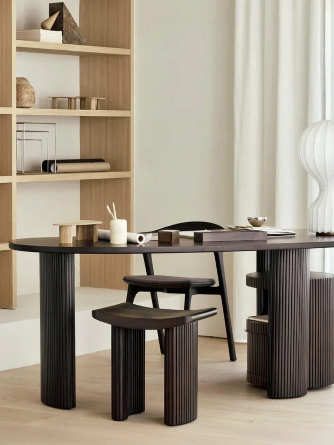 A bean shaped desk with ribbed wood feet from Ethnicraft