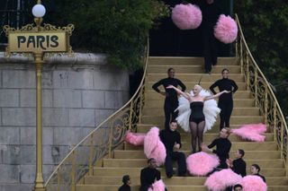 US' singer Lady Gaga sings a song at the Sully bridge area before the opening ceremony of the Paris 2024 Olympic Games in Paris 