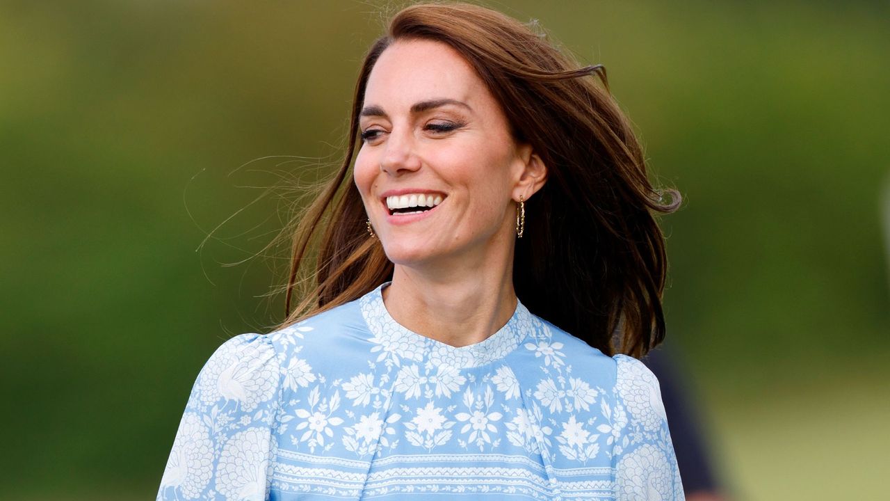 Catherine, Princess of Wales attends the Out-Sourcing Inc. Royal Charity Polo Cup 2023 at Guards Polo Club, wearing a white and blue dress