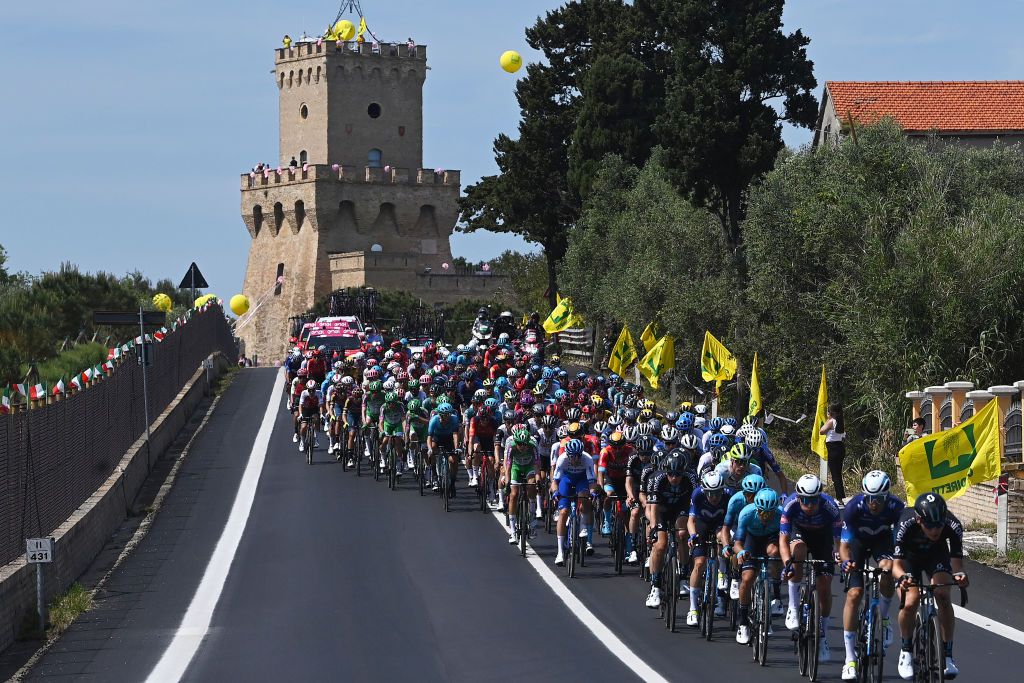 SAN SALVO ITALY MAY 07 A general view of the peloton passing close to the Torre di Cerrano at Pineto Village during the 106th Giro dItalia 2023 Stage 2 a 202km stage from Teramo to San Salvo UCIWT on May 07 2023 in San Salvo Italy Photo by Tim de WaeleGetty Images