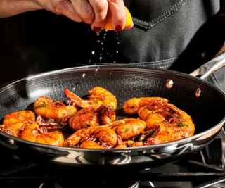 Sizzling prawns in a large HexClad fry pan