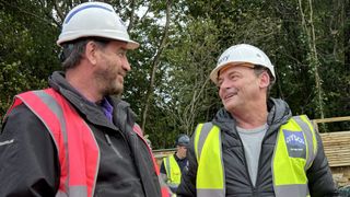 Nick Knowles and Perry Fenwick in hard hats chat in DIY SOS: EastEnders
