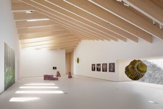 gallery with exposed ceiling beams at chappe art house