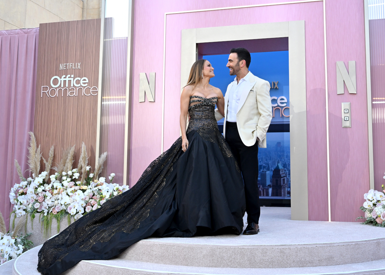 LOS ANGELES, CALIFORNIA - MAY 26: (L-R) Jennifer Lopez and Brett Goldstein attend the world premiere of Netflix's &amp;quot;Office Romance&amp;quot; at The Egyptian Theatre Hollywood on May 26, 2026 in Los Angeles, California.
