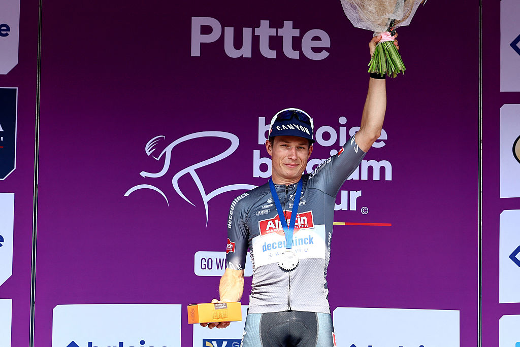 Team Alpecin-Deceuninck Belgian rider Jasper Philipsen celebrates on the podium after winning the second stage of the Baloise Belgium Tour cycling race, 194,6 km from Beringen to Putte, in Putte on June 19, 2025. (Photo by DAVID PINTENS / Belga / AFP) / Belgium OUT