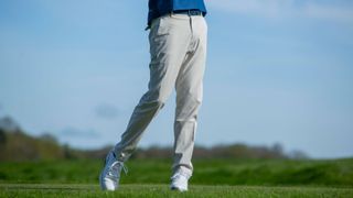 A golfer wears a pair of Nike Repel Chino Pants