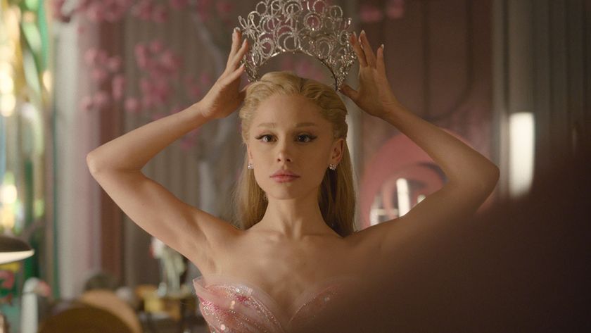 Ariana Grande somberly places a crown on her head in Wicked: For Good.